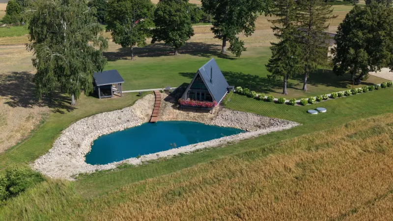 The «Teiči» A-Frame cabin and pond from the air